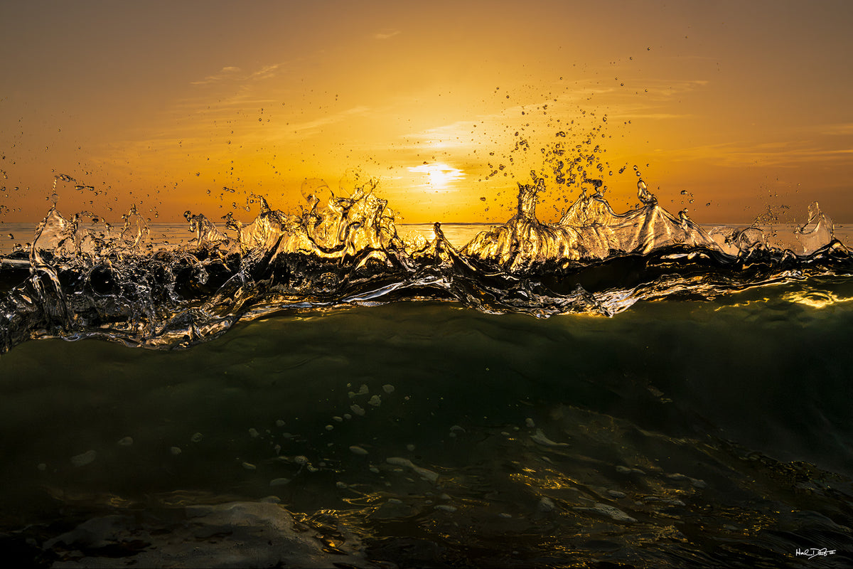 Color print of the August 24, 2026 Playalinda Beach sunrise, backlit breaking wave