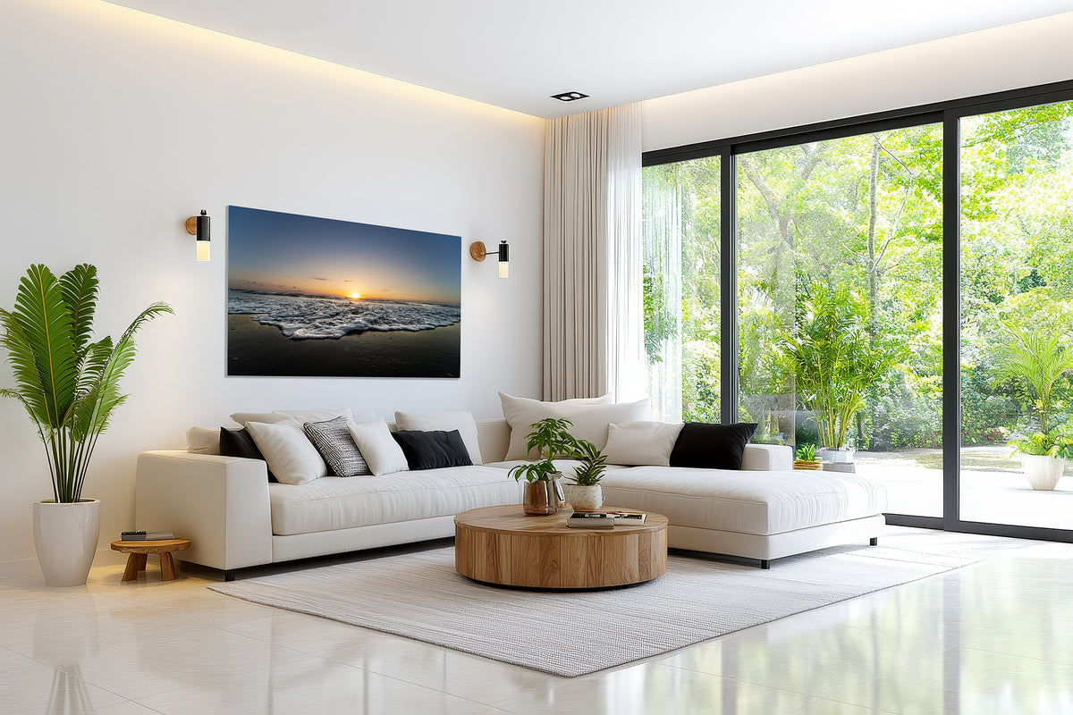 Color print of the July 2, 2026 Playalinda Beach, Florida sunrise displayed in a bright modern living room with greenery