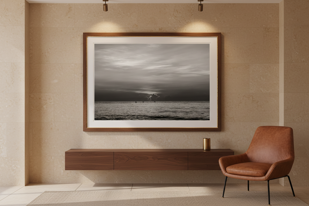 Black and white sunrise wall art from August 15, 2026, St. Augustine Beach, displayed in a boutique entry lounge