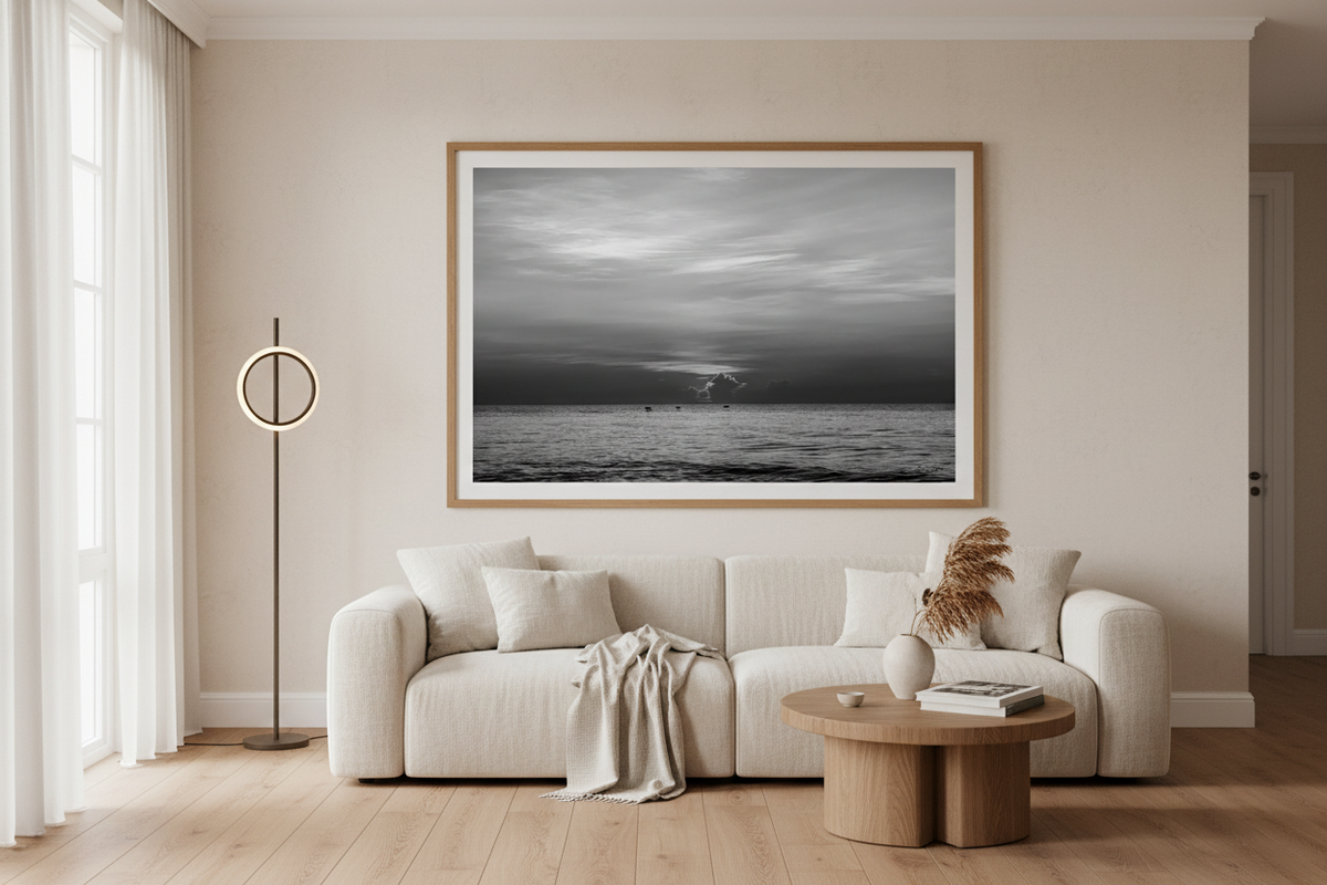 Black and white sunrise wall art from August 15, 2026, St. Augustine Beach, displayed in a coastal living room