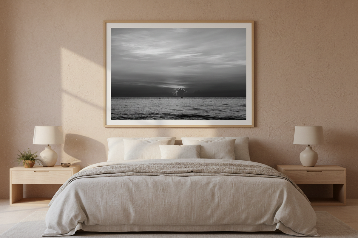 Black and white sunrise wall art from August 15, 2026, St. Augustine Beach, displayed in a quiet-luxury bedroom